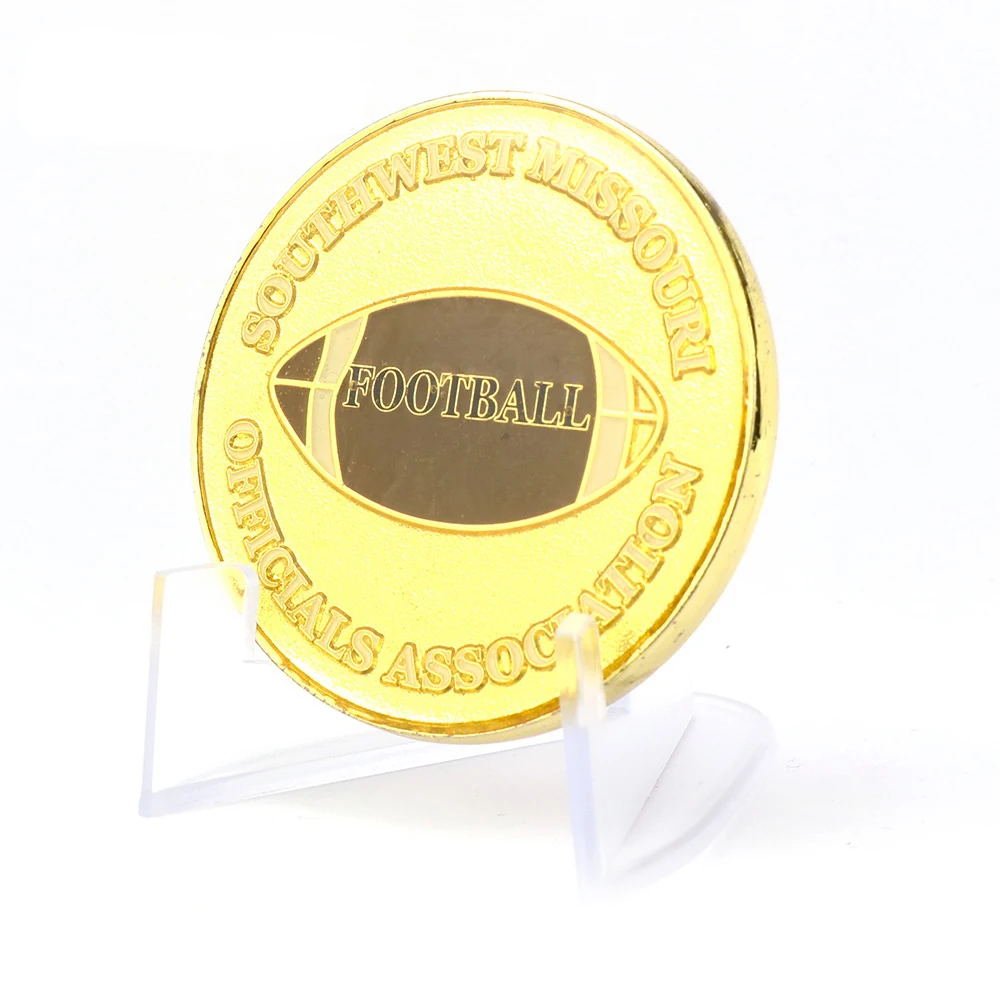 Gold challenge coin reverse face showing struck relief