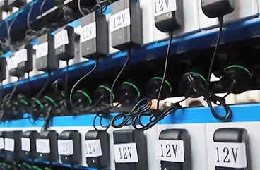 Aging rack running units at 12V to catch early failures
