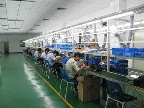 Workers on an electronics assembly line at a CCTV manufacturer in China