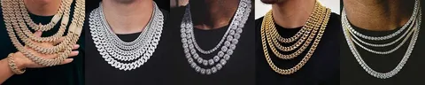 A row of Cuban link and tennis chains displayed on busts