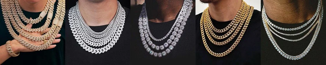 A row of Cuban link and tennis chains displayed on busts
