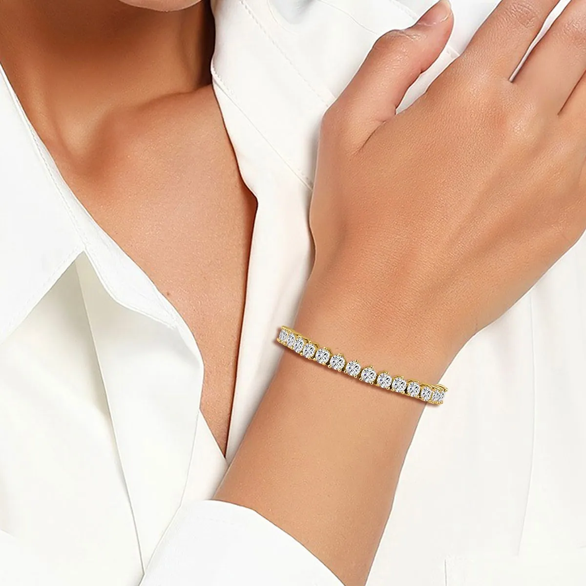 Cubic zirconia tennis bracelet worn on the wrist with a white shirt cuff