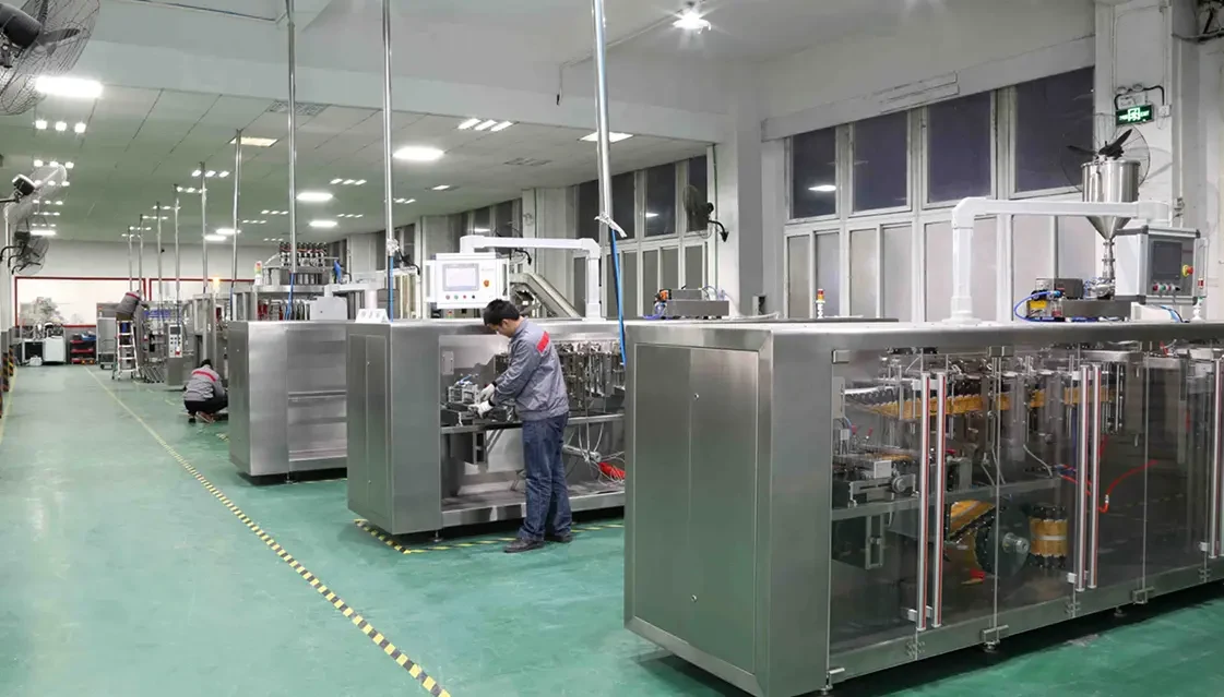 Boevan factory floor with pouch packaging machines under assembly and test