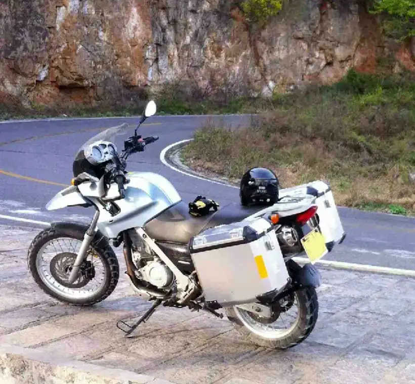 Adventure motorcycle fitted with Brooks aluminum panniers