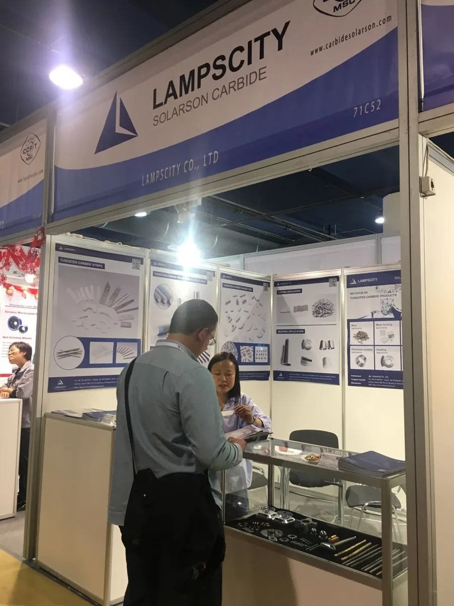 Discussing carbide specifications with visitors at the stand