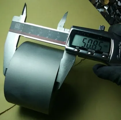 Carbide die blank under caliper inspection