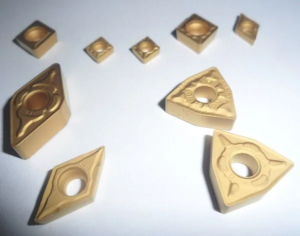 Mixed tungsten carbide insert shapes coated and uncoated