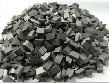 Tungsten carbide saw tips in production quantity ready for brazing