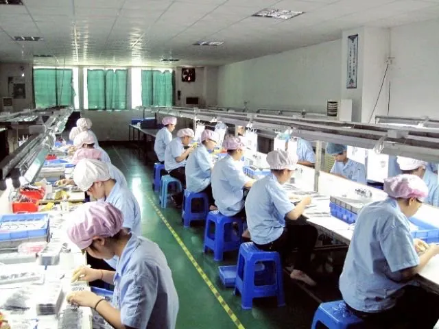 Second assembly line running components down a bench conveyor.