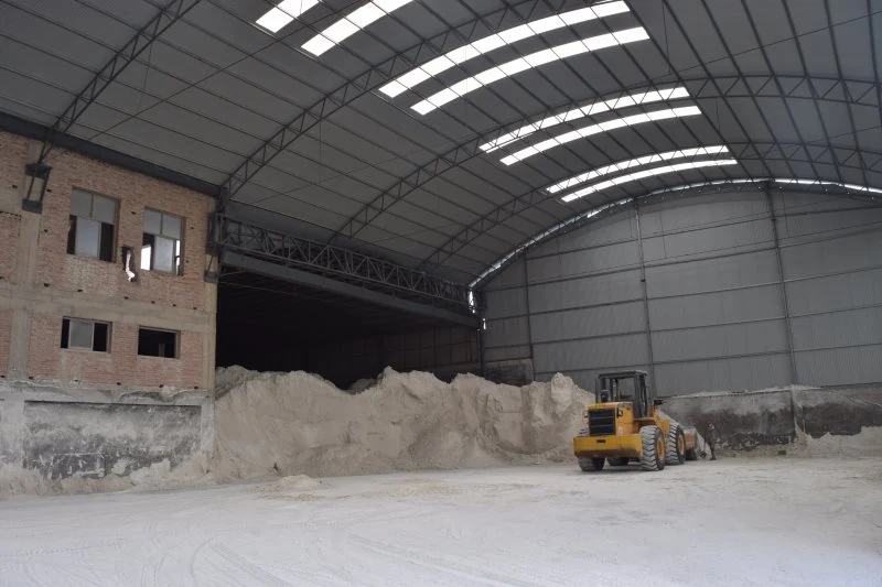 Powder stockpile and loader inside the storage building