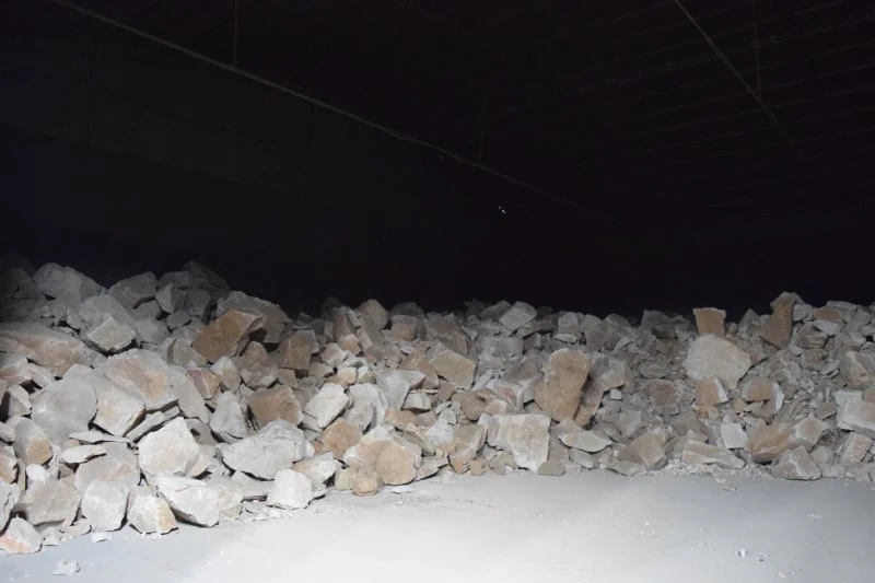 Crushed ore stockpile inside the storage building
