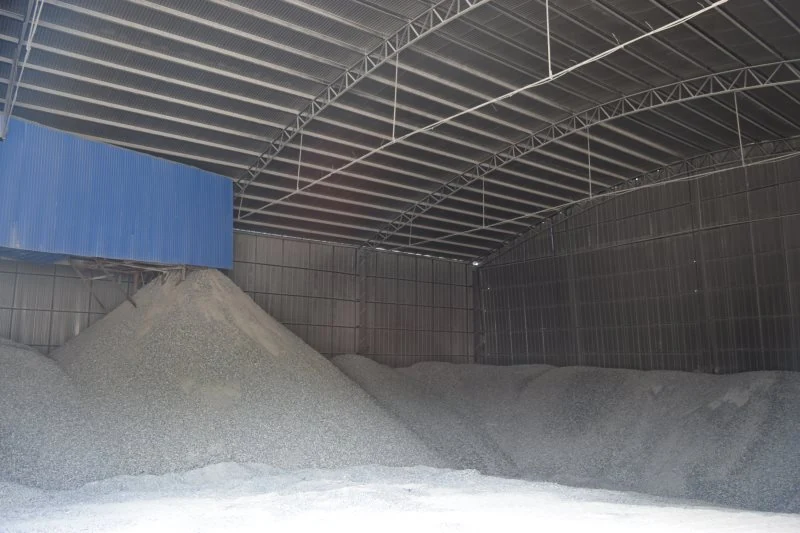 Bulk powder stockpile in the enclosed warehouse