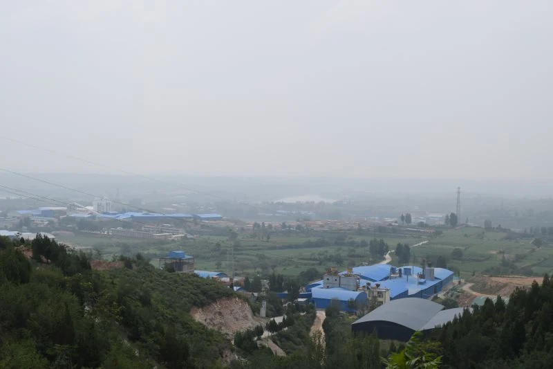 Hillside view of the plant surrounded by farmland