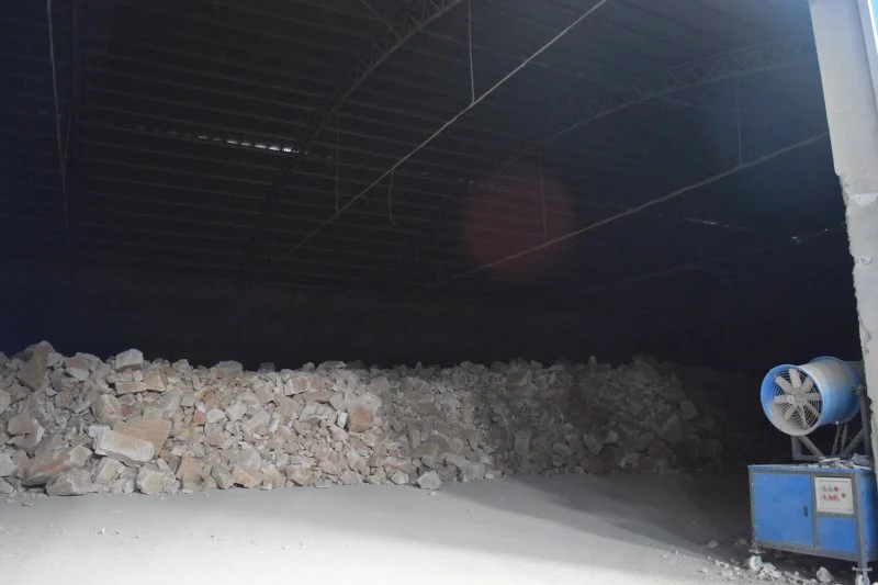 Raw ore stored under the plant roof