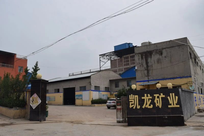 Factory entrance and yard with the company sign