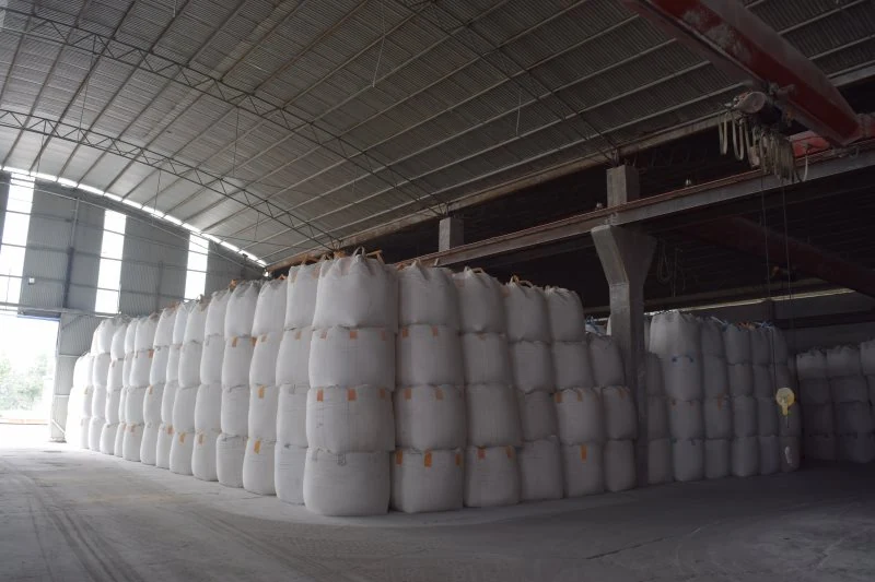 FIBC jumbo bags stacked in rows in the warehouse
