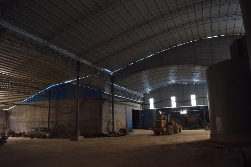 Warehouse interior with bagged product and a loader