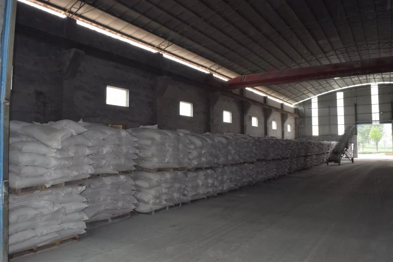 Row of jumbo bags along the warehouse wall