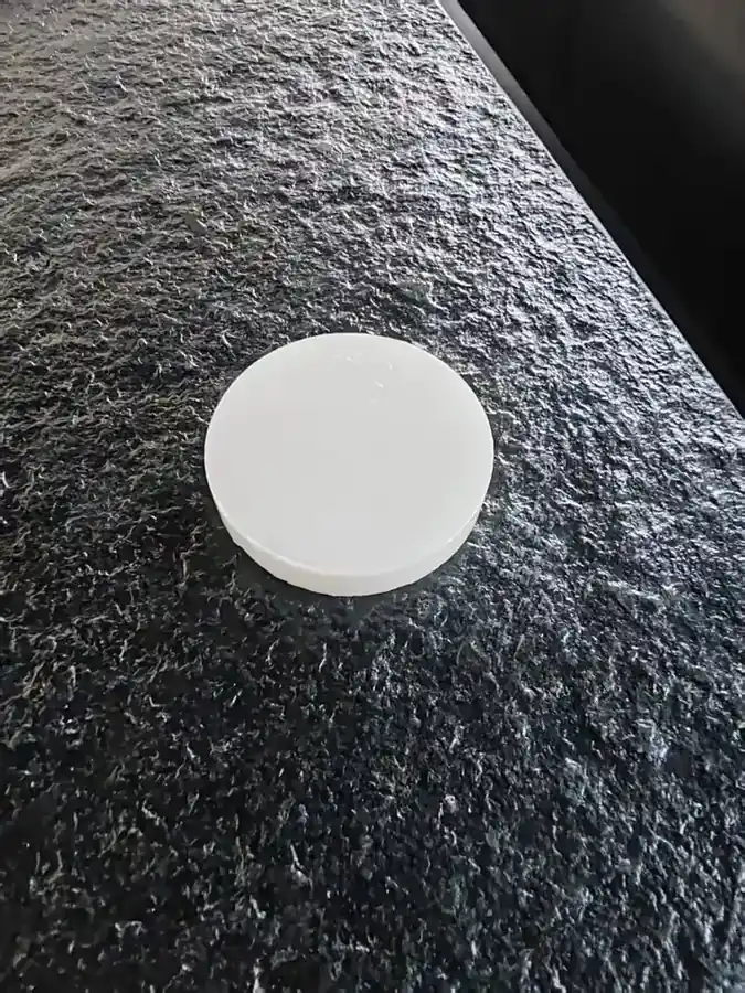 Fired whiteness disc pressed from potassium feldspar