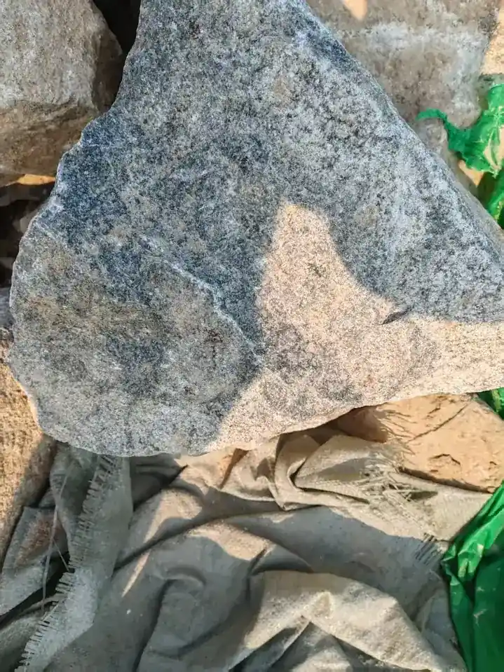 Raw nepheline syenite rock showing its crystal structure