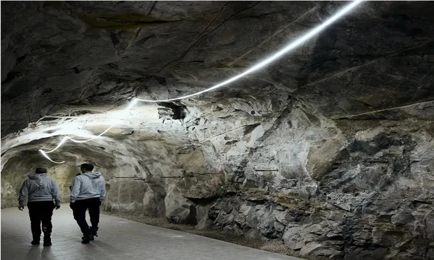 Underground development with strip light along the crown.