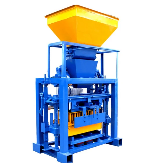 Block machine with a yellow feed hopper above the moulding station