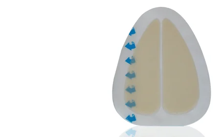 Triangular medical adhesive dressing with blue peel tabs on a plain white background