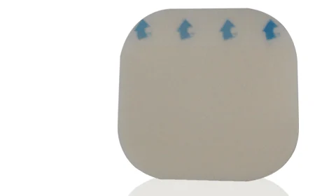Square adhesive medical dressing patch with rounded corners and blue directional arrows on white background