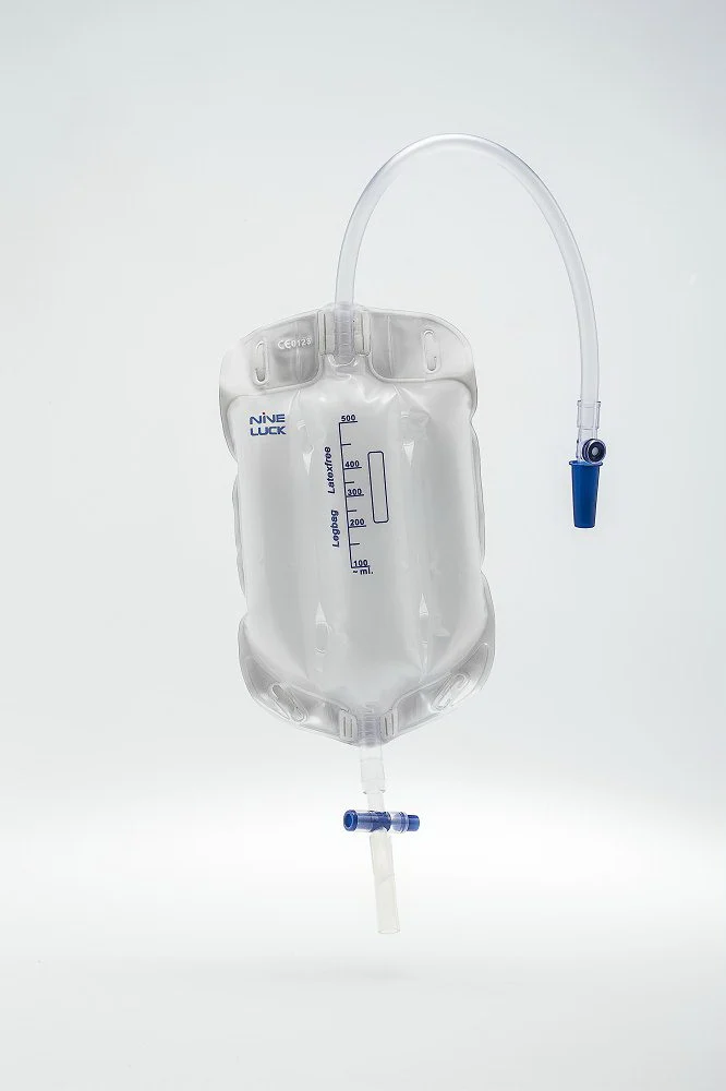 Medical urinary drainage leg bag with tubing against white background
