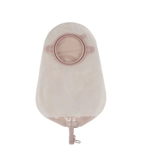Beige ostomy drainage pouch with round flange and bottom valve on white background
