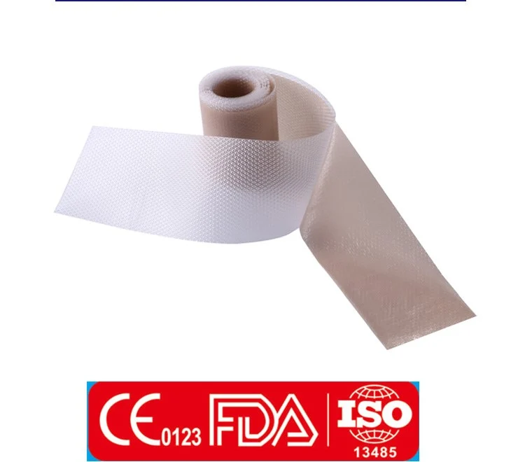 Roll of uncoiled textured medical tape with certification badges below