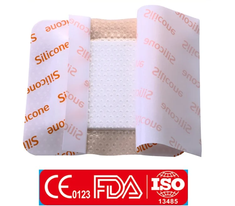 Silicone foam wound dressing with partially peeled backing sheets