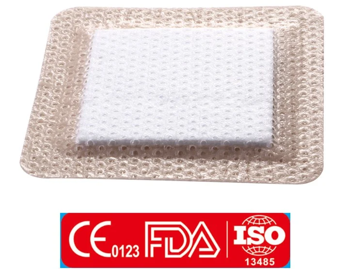 Square adhesive wound dressing with central pad above certification logos
