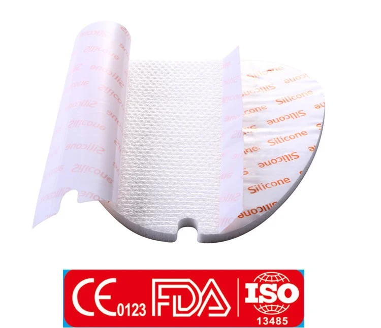 Silicone foam medical dressing with peel-off release film on a white background