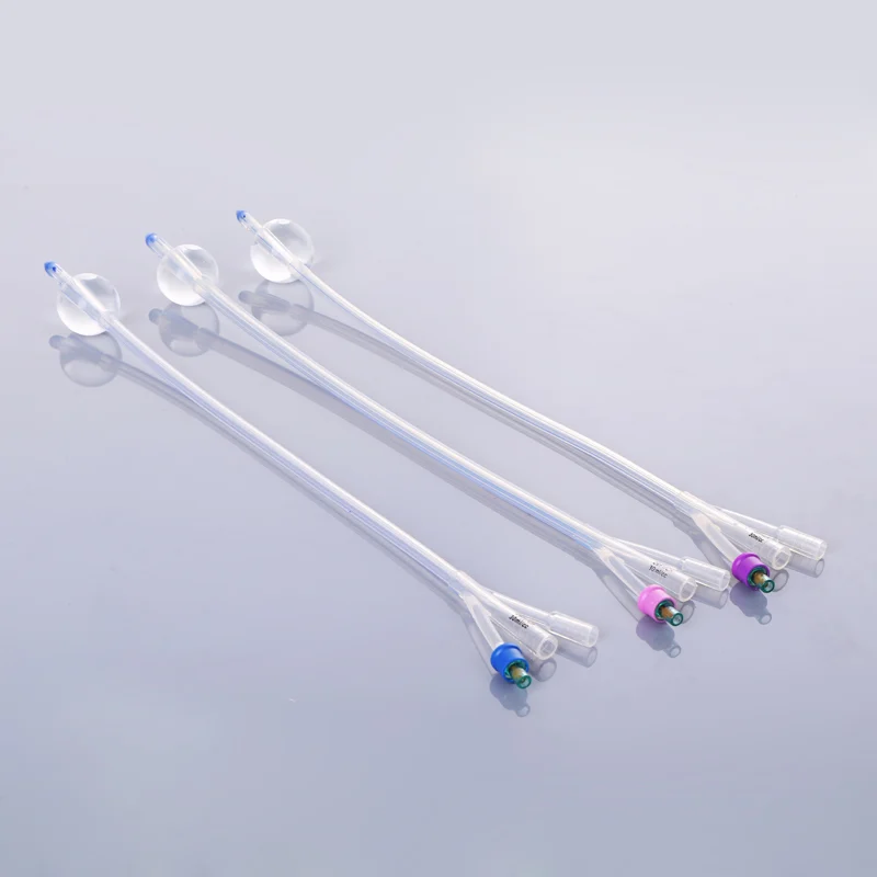 Three silicone Foley catheters with inflated balloons