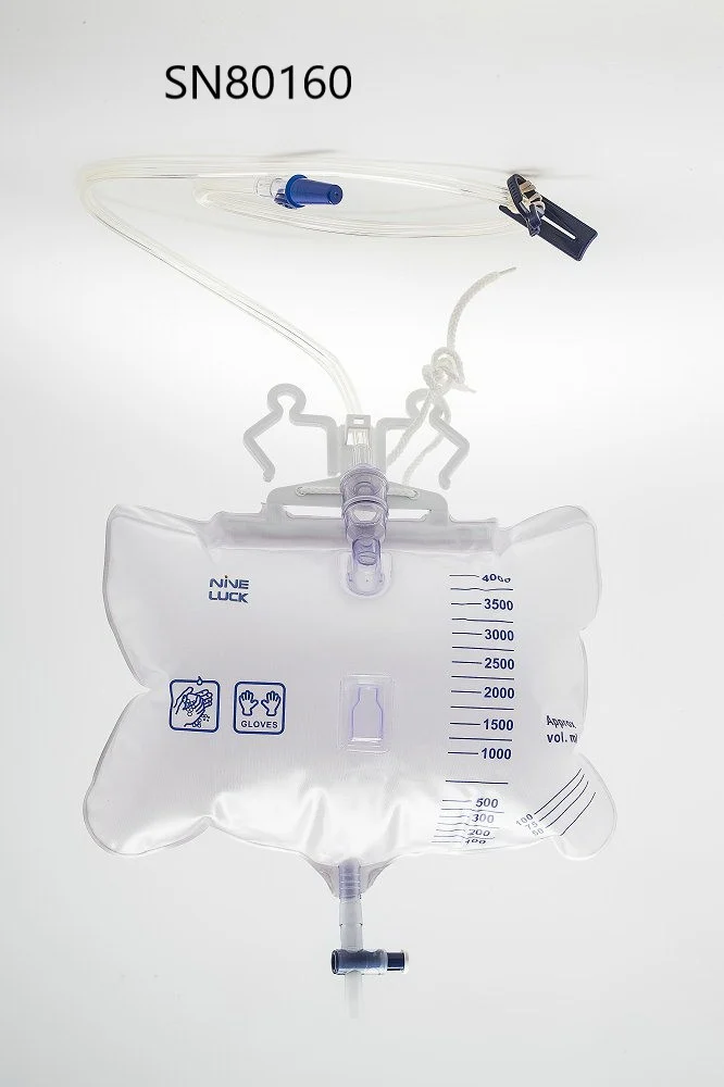 Medical drainage bag with graduated markings, tubing, and hanger hooks on plain background