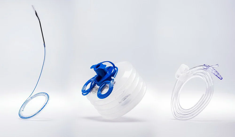 Medical drainage kit components on a white background