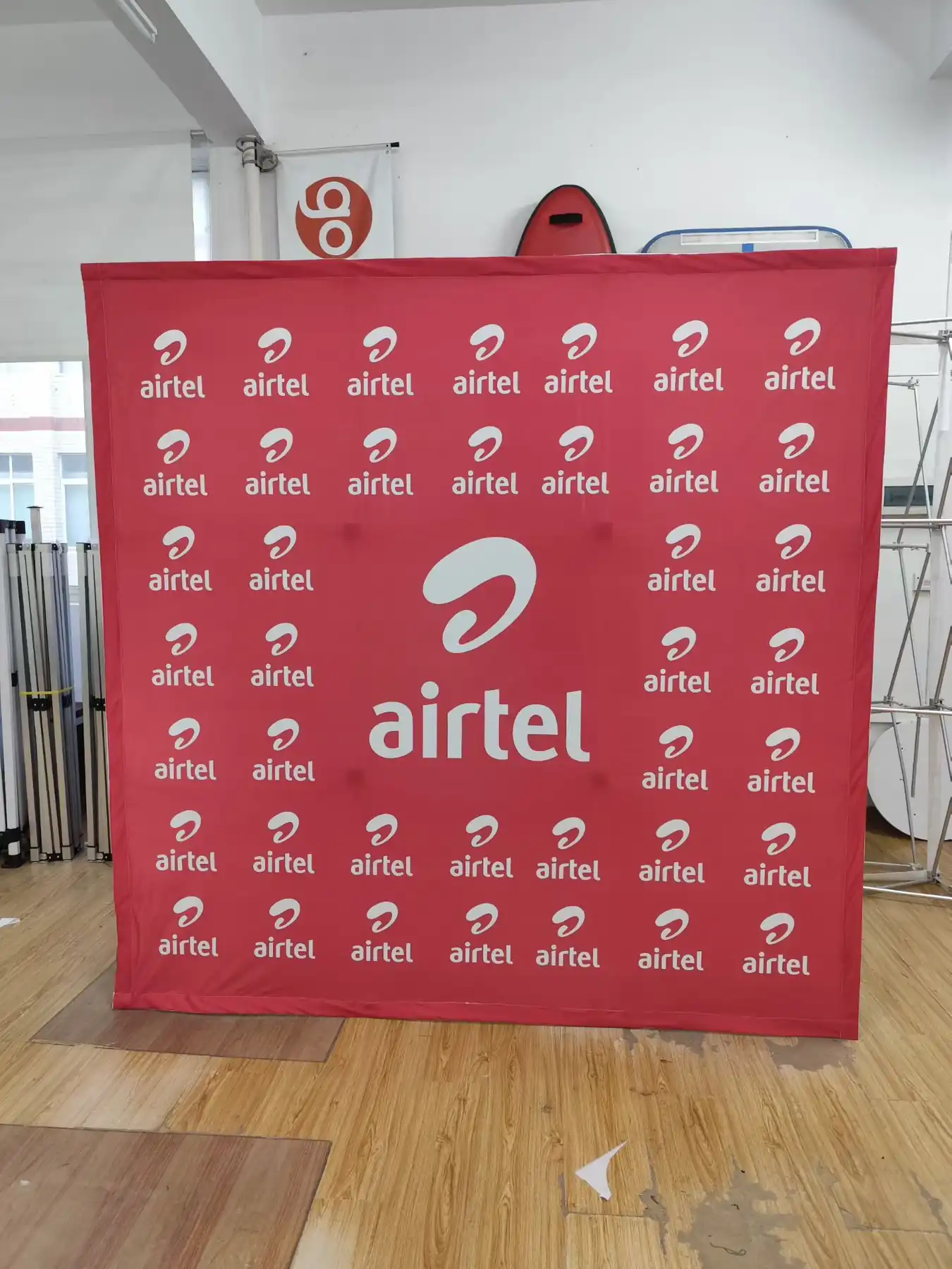 Promotional fabric banner hanging above a retail display