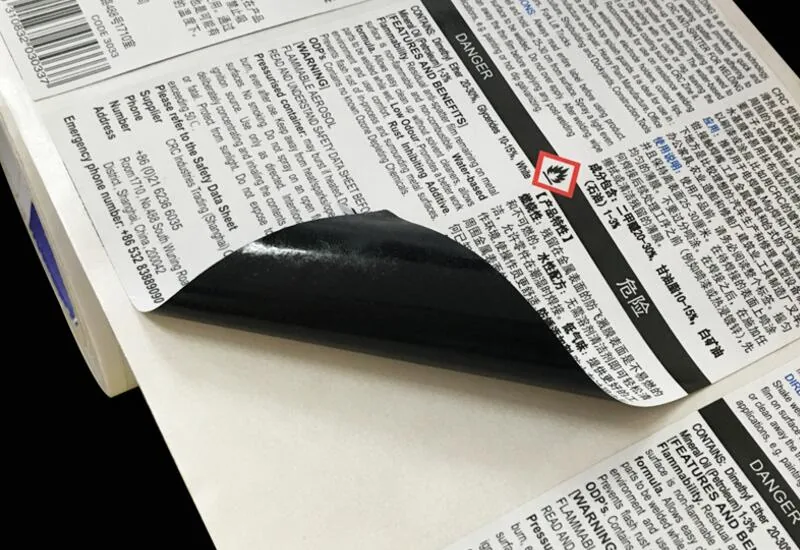 Black adhesive back label applied to a beverage bottle