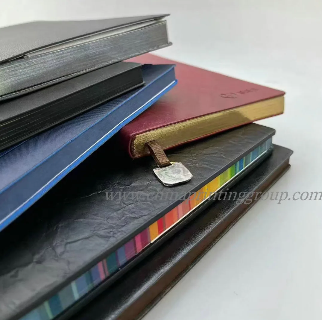 Branded notebook closed to show gold painted page edges