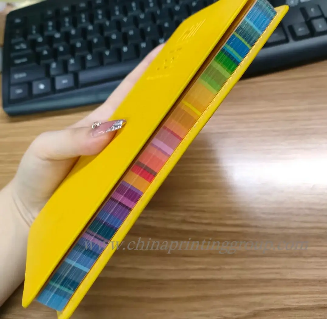 Custom PU notebook opened to show lined 100gsm inner pages