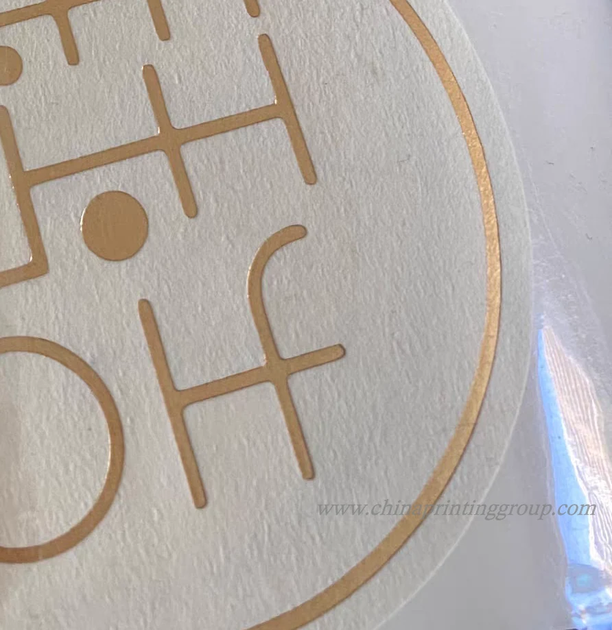 Embossed business logo sticker sealing a product box