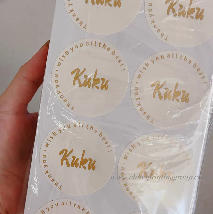 Gold overlay logo stickers with embossed brand mark