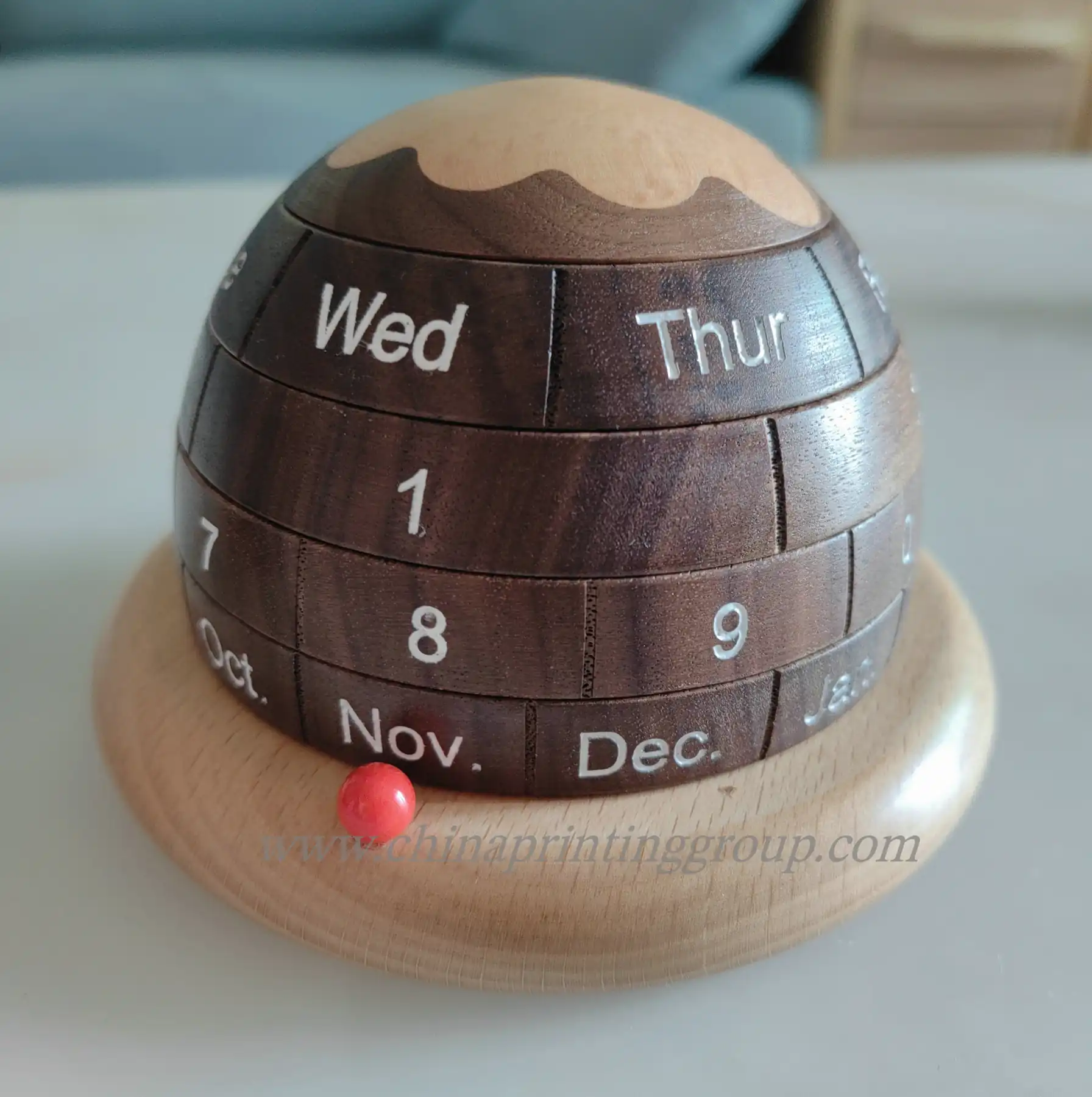 Wooden desk calendar showing the current date on turned blocks