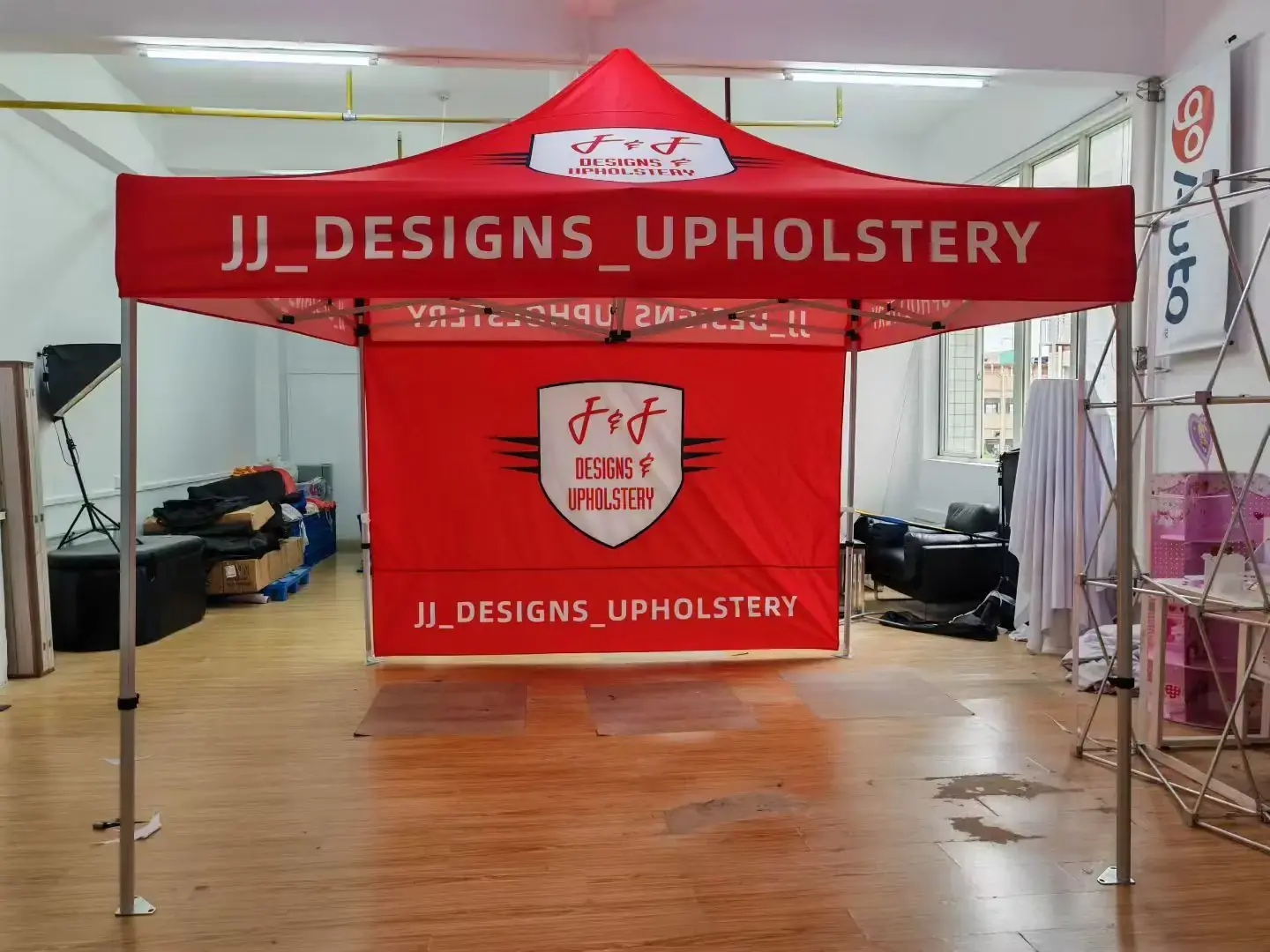 10x10 ft branded canopy tent set up on a festival pitch