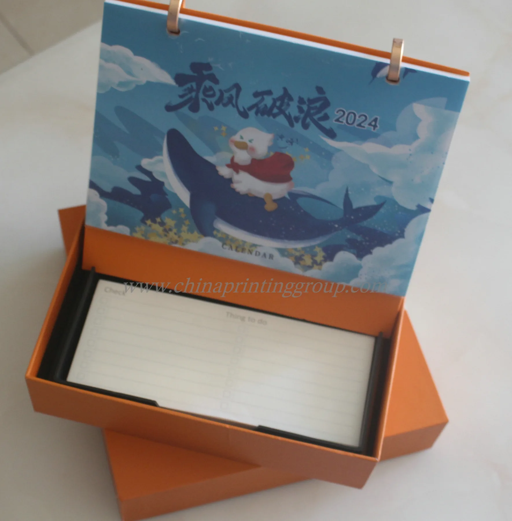 Custom table calendar with twin wire binding and thick paper pages