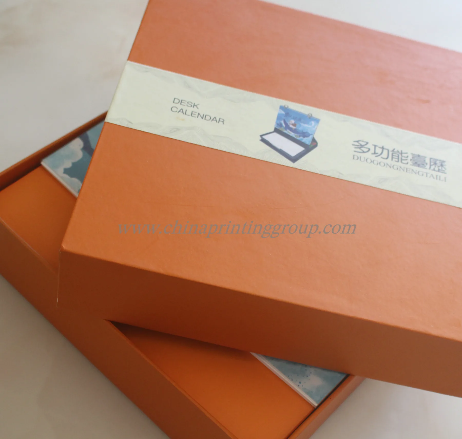 Desk tent calendar showing monthly pages and printed branding