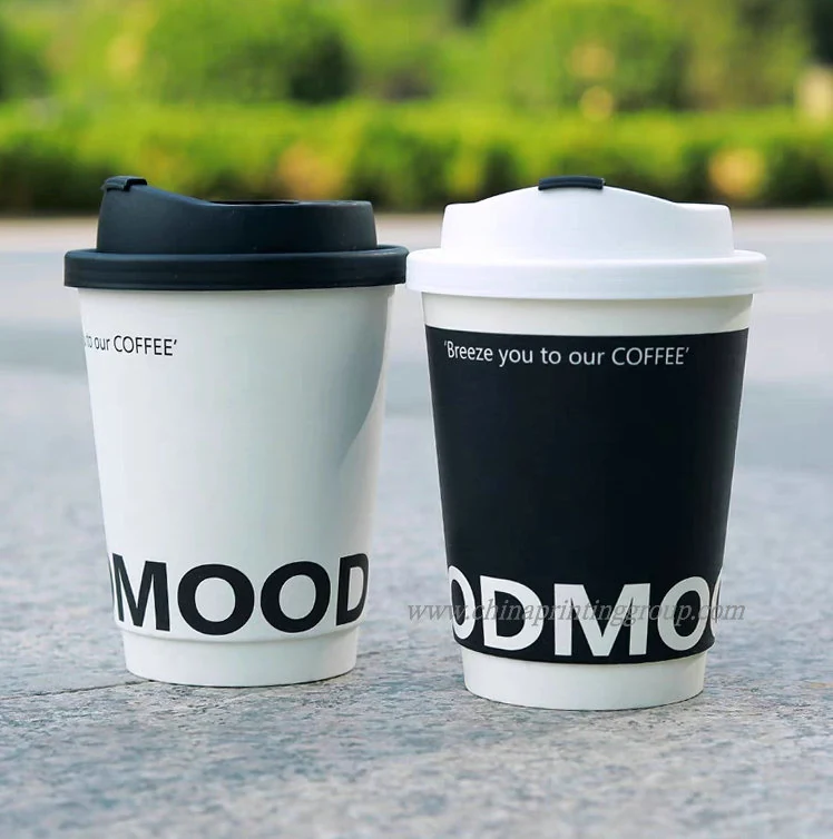 Takeaway paper cups with lids fitted stacked together