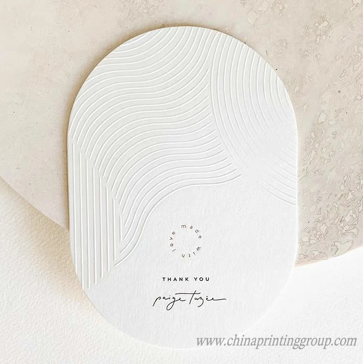 Round shaped letterpress business card cut to a custom outline