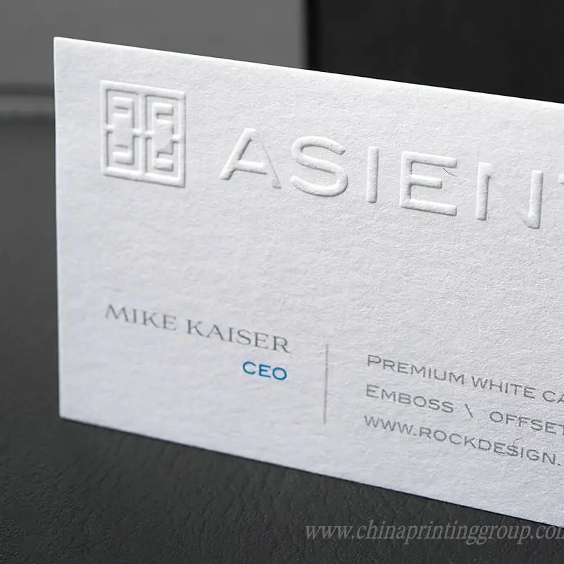 Embossed letterpress name card showing pressed logo detail